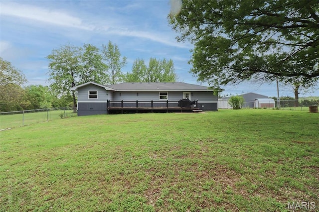 back of property with a wooden deck