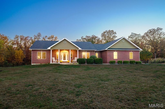 10365 Justin Cir, Rolla, MO 65401 - ranch-style home featuring a front lawn, brick siding, and covered porch