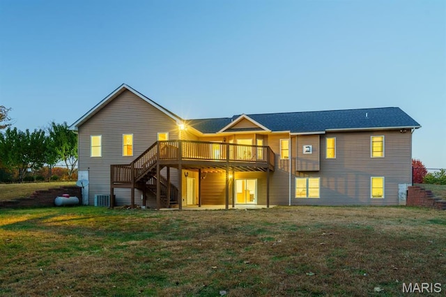 10365 Justin Cir, Rolla, MO 65401 - back of house with a lawn, stairs, a deck, and central air condition unit