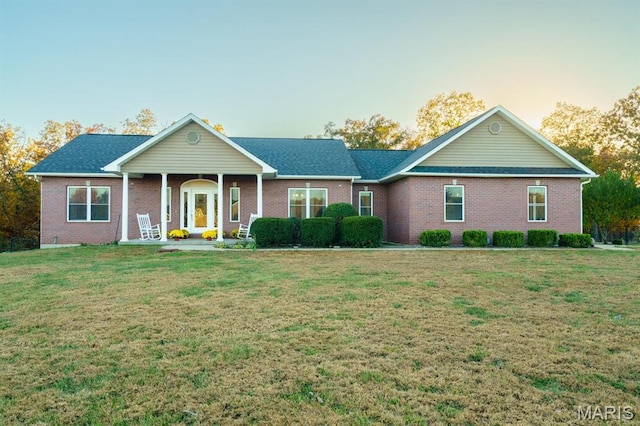 10365 Justin Cir, Rolla, MO 65401 - ranch-style house with brick siding, a front lawn, and a porch