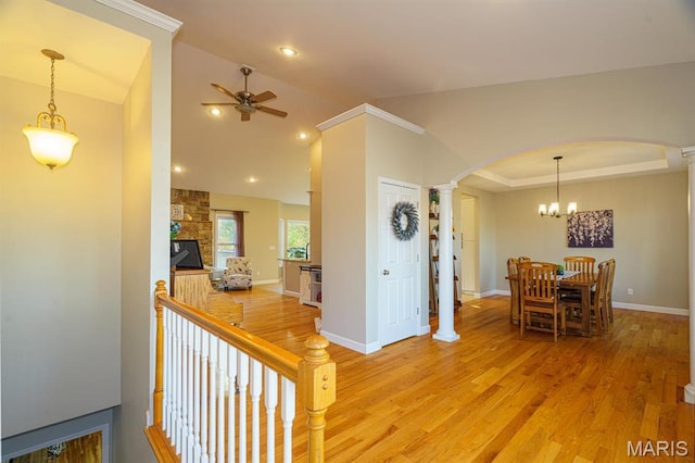 10365 Justin Cir, Rolla, MO 65401 - corridor with arched walkways, ornate columns, light wood finished floors, vaulted ceiling, and baseboards