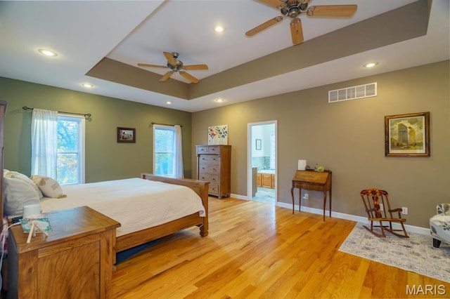 10365 Justin Cir, Rolla, MO 65401 - bedroom with light wood-type flooring, recessed lighting, a raised ceiling, and baseboards