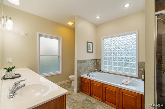 10365 Justin Cir, Rolla, MO 65401 - full bath featuring healthy amount of natural light, a garden tub, toilet, and a tile shower