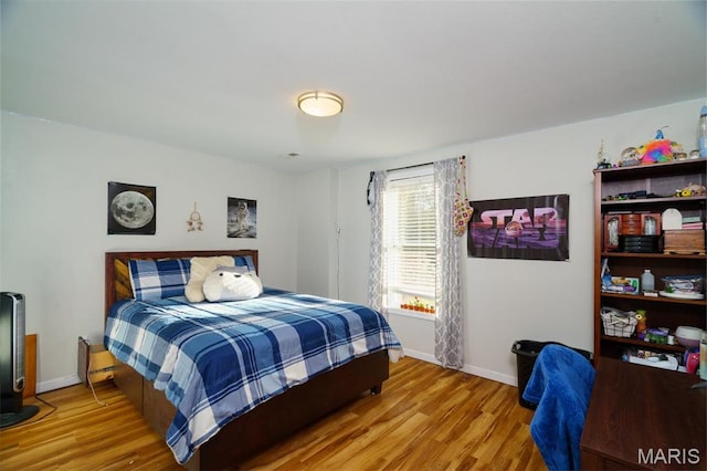 10365 Justin Cir, Rolla, MO 65401 - bedroom with wood finished floors and baseboards