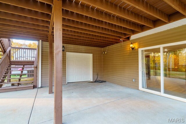 10365 Justin Cir, Rolla, MO 65401 - view of patio featuring driveway and a garage