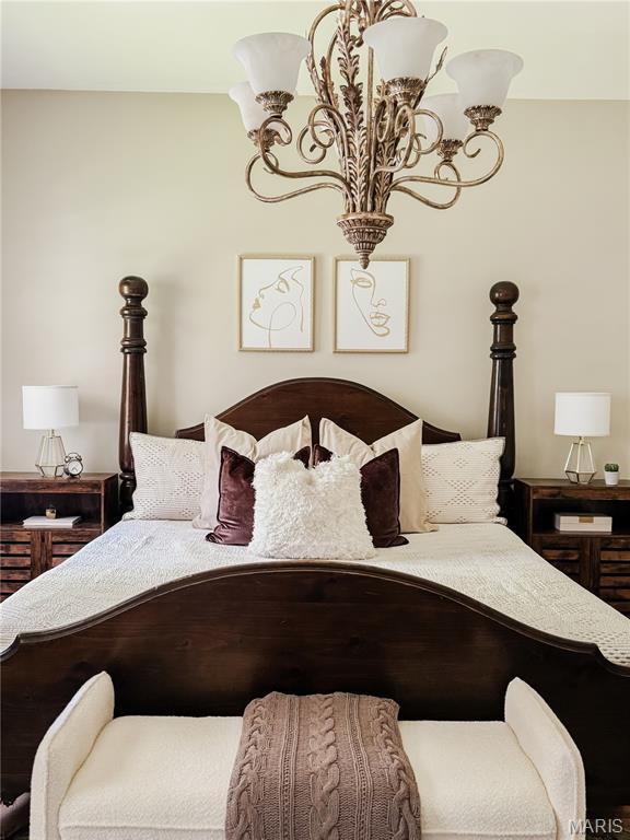 24 S Barat Ave, Saint Louis, MO 63135 - bedroom with a chandelier