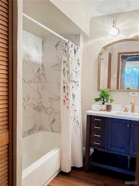 24 S Barat Ave, Saint Louis, MO 63135 - full bath featuring wood finished floors, shower / bathtub combination with curtain, and vanity
