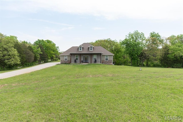 5814 Calvey Creek Rd, Robertsville, MO 63072 - cape cod house featuring a front yard, covered porch, and driveway