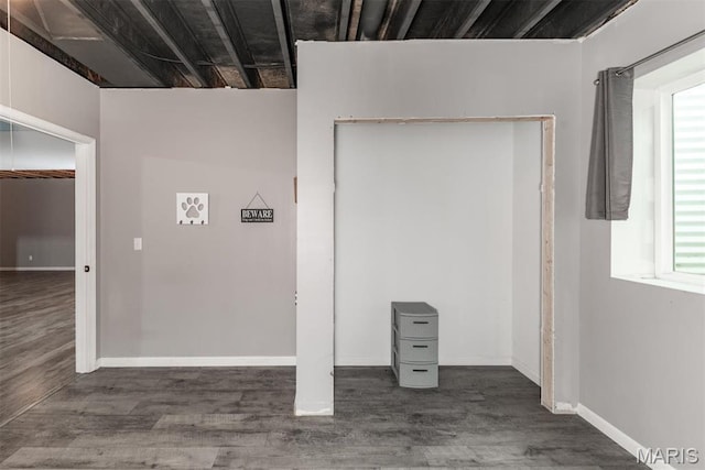 5814 Calvey Creek Rd, Robertsville, MO 63072 - below grade area featuring wood finished floors, plenty of natural light, and baseboards
