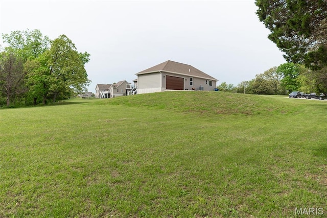 5814 Calvey Creek Rd, Robertsville, MO 63072 - view of grassy yard with a garage