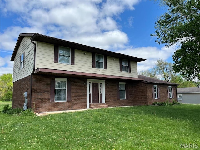 1235 S Hackman St, Staunton, IL 62088 - view of front of house featuring brick siding and a front lawn