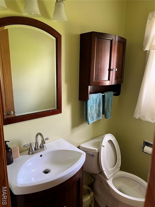 1235 S Hackman St, Staunton, IL 62088 - half bathroom featuring toilet and vanity