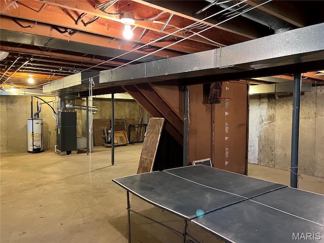 1235 S Hackman St, Staunton, IL 62088 - unfinished below grade area with gas water heater and heating unit