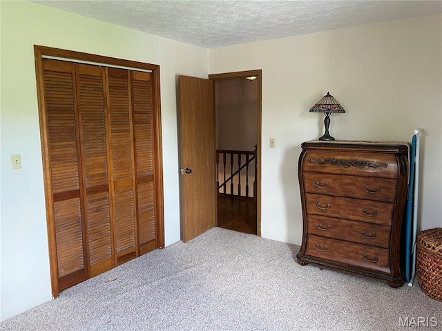 1235 S Hackman St, Staunton, IL 62088 - bedroom with carpet flooring, a closet, and a textured ceiling