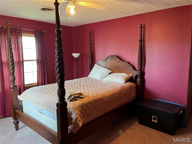 1235 S Hackman St, Staunton, IL 62088 - carpeted bedroom with ceiling fan and a textured ceiling