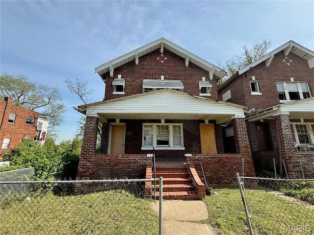 5723 Labadie Ave, Saint Louis, MO 63120 - view of front of house with covered porch and brick siding