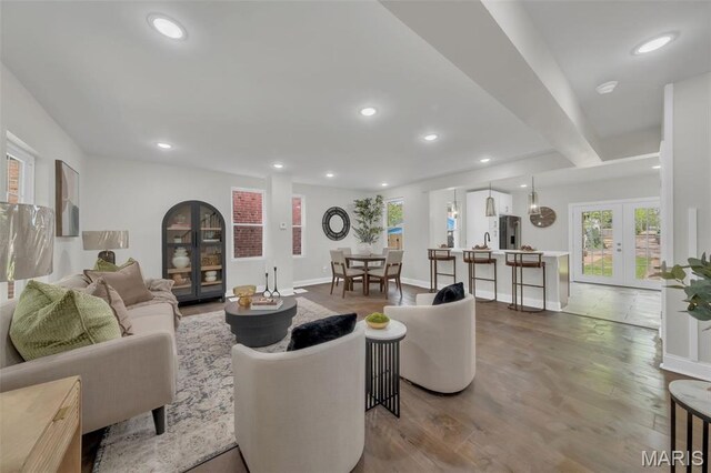 6815 Wise Ave, Saint Louis, MO 63139 - living room with french doors, recessed lighting, wood finished floors, and baseboards