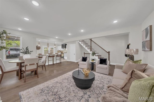 6815 Wise Ave, Saint Louis, MO 63139 - living area with stairway, wood finished floors, recessed lighting, and baseboards