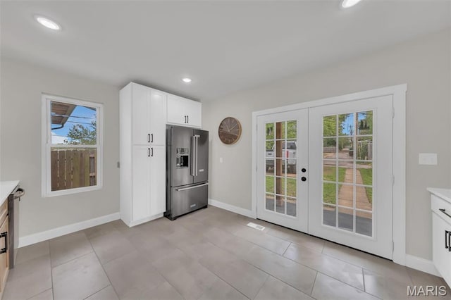 6815 Wise Ave, Saint Louis, MO 63139 - kitchen with high quality fridge, french doors, plenty of natural light, baseboards, and recessed lighting