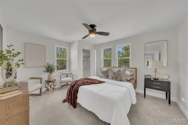 6815 Wise Ave, Saint Louis, MO 63139 - bedroom with light colored carpet, baseboards, and a ceiling fan