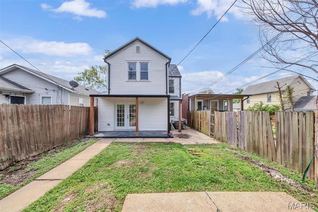 6815 Wise Ave, Saint Louis, MO 63139 - back of house with french doors and a patio