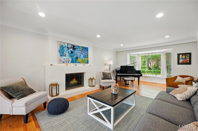 24 Rio Vista Dr, Saint Louis, MO 63124 - living room with a glass covered fireplace, recessed lighting, and wood finished floors