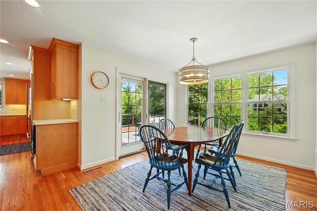 24 Rio Vista Dr, Saint Louis, MO 63124 - dining space with healthy amount of natural light, baseboards, light wood-style flooring, and recessed lighting