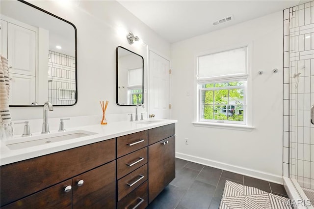 24 Rio Vista Dr, Saint Louis, MO 63124 - bathroom featuring baseboards, double vanity, and tile patterned flooring