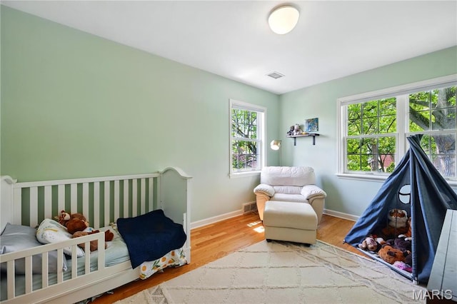 24 Rio Vista Dr, Saint Louis, MO 63124 - bedroom with wood finished floors and baseboards