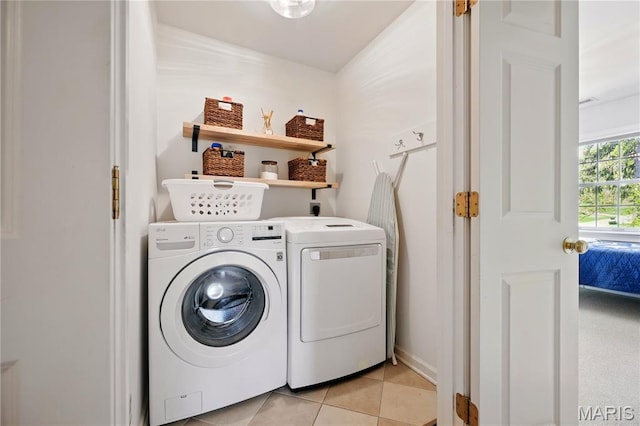 24 Rio Vista Dr, Saint Louis, MO 63124 - laundry room featuring washer and clothes dryer and light tile patterned floors