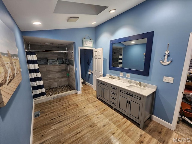 91 N Chantilly Rd, Winfield, MO 63389 - full bath with baseboards, wood finished floors, a shower stall, toilet, and double vanity