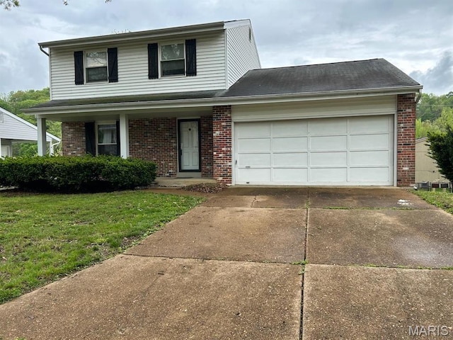 3844 Red Bud Dr, Imperial, MO 63052 - traditional home with brick siding, driveway, a front lawn, and a garage