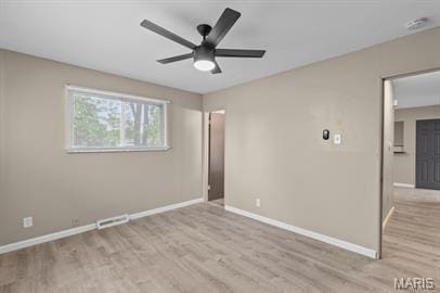 1605 Koch Dr, Florissant, MO 63033 - unfurnished bedroom featuring wood finished floors and baseboards