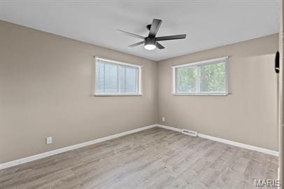 1605 Koch Dr, Florissant, MO 63033 - empty room with baseboards, a ceiling fan, and wood finished floors