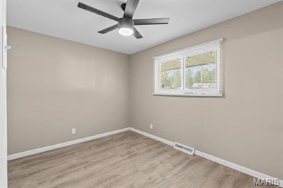1605 Koch Dr, Florissant, MO 63033 - empty room with baseboards, light wood-type flooring, and ceiling fan