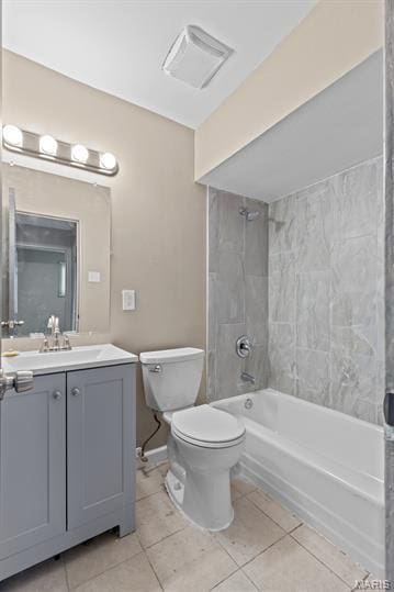 1605 Koch Dr, Florissant, MO 63033 - bathroom featuring tile patterned floors, toilet,  shower combination, and vanity