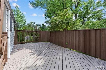 1605 Koch Dr, Florissant, MO 63033 - wooden deck with fence
