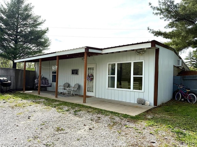 56 Berger Rd, Middletown, MO 63359 - rear view of property featuring a patio area and fence