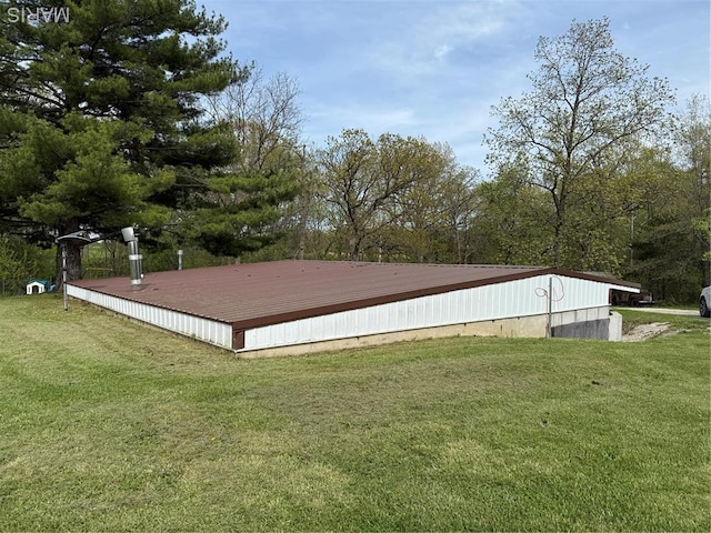 56 Berger Rd, Middletown, MO 63359 - view of side of property with a lawn and metal roof