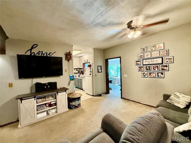 56 Berger Rd, Middletown, MO 63359 - living area featuring a ceiling fan, light colored carpet, baseboards, and a textured ceiling