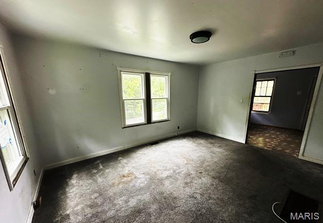 9909 Baltimore St, Belleville, IL 62223 - spare room featuring carpet flooring and baseboards
