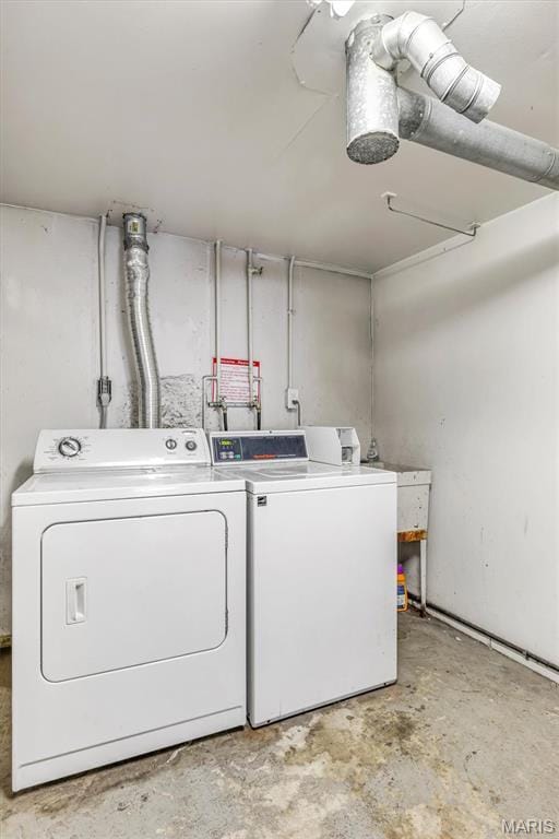 washroom with washer and dryer