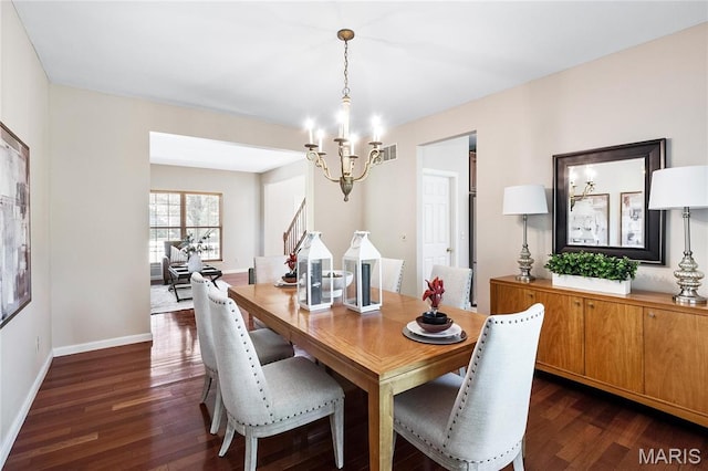 1309 Wellington Valley Ct, Chesterfield, MO 63005 - dining room with a chandelier, dark wood finished floors, and baseboards