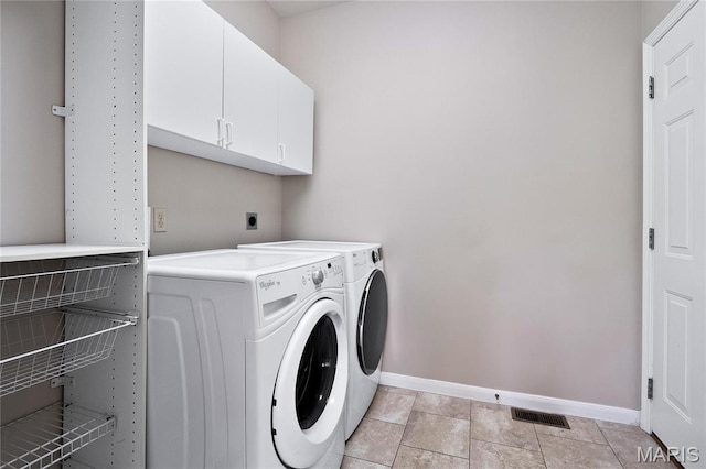 1309 Wellington Valley Ct, Chesterfield, MO 63005 - laundry area featuring baseboards, cabinet space, and washer and dryer