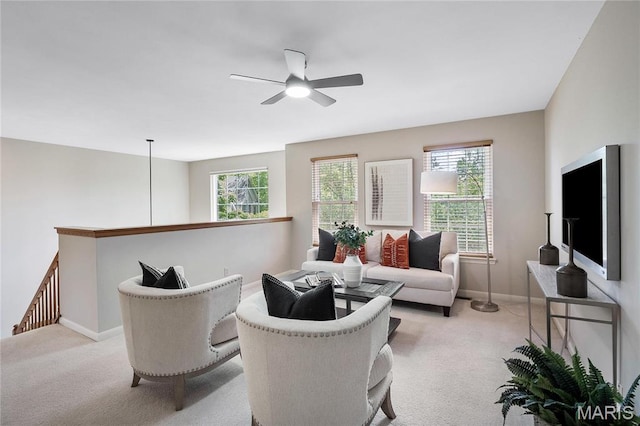1309 Wellington Valley Ct, Chesterfield, MO 63005 - living room featuring ceiling fan, light carpet, healthy amount of natural light, and baseboards