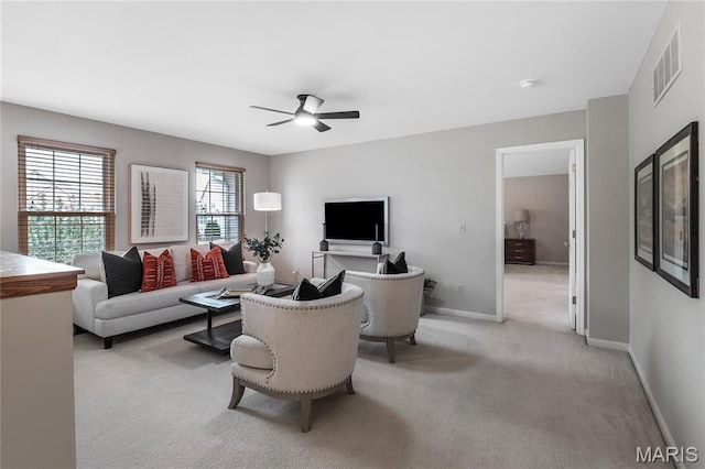 1309 Wellington Valley Ct, Chesterfield, MO 63005 - living room featuring a ceiling fan, light colored carpet, and baseboards
