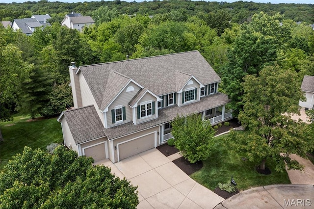 1309 Wellington Valley Ct, Chesterfield, MO 63005 - aerial view of property and surrounding area featuring a heavily wooded area