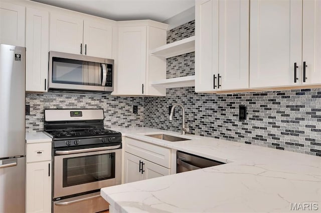 1316 Holgate Dr Unit G5, Ballwin, MO 63021 - kitchen featuring appliances with stainless steel finishes, open shelves, and backsplash