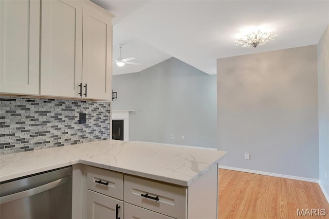 1316 Holgate Dr Unit G5, Ballwin, MO 63021 - kitchen with dishwasher, a peninsula, light wood finished floors, backsplash, and ceiling fan