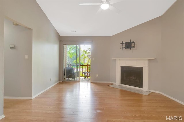 1316 Holgate Dr Unit G5, Ballwin, MO 63021 - unfurnished living room featuring light wood-style flooring, ceiling fan, a fireplace with flush hearth, baseboards, and vaulted ceiling